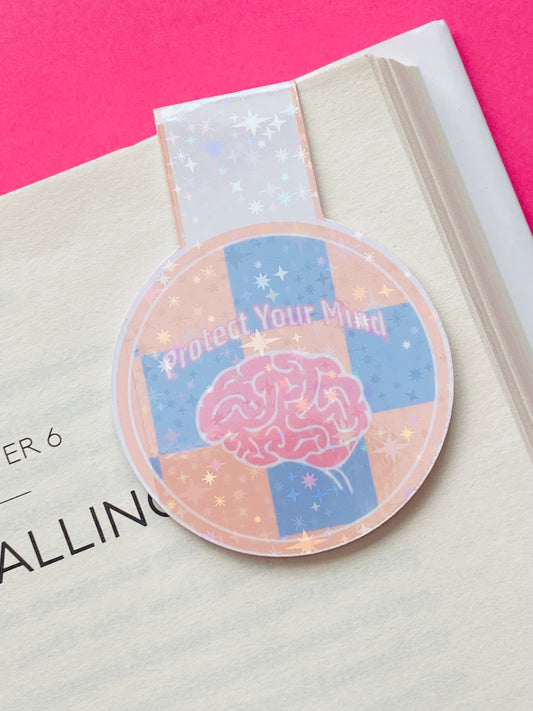Glossy white Cardstock magnetic bookmark with the image of a brain on a blue and orange checked background and text caption of “Protect Your Mind”
