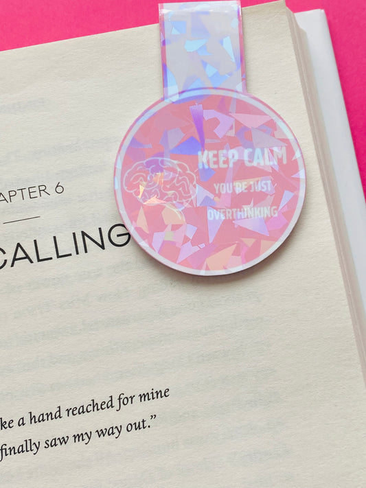 Glossy white Cardstock magnetic bookmark with the image of a brain and text caption of “Keep Calm You’re Overthinking”